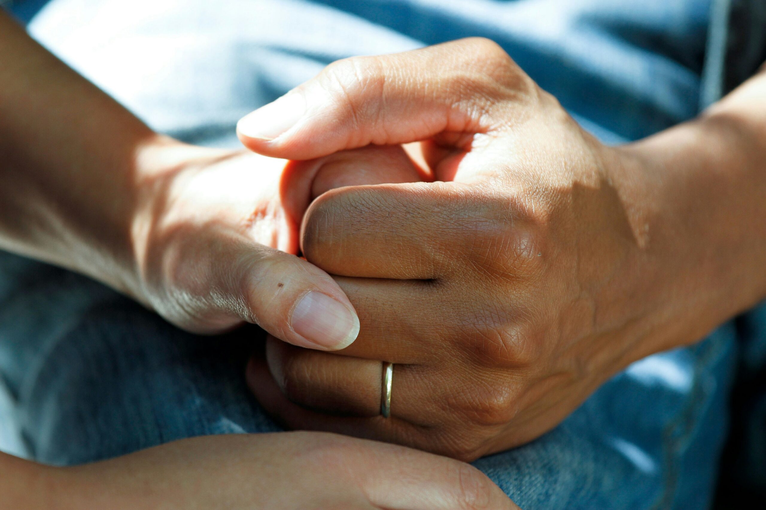 Supportive hand-holding between loved ones during the early weeks of C-section recovery at home